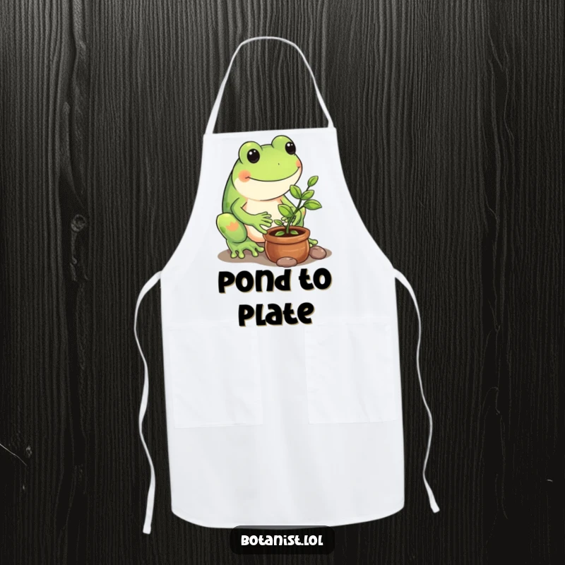 Funny apron graphic of a playful frog carefully tending to a tiny potted sapling, ready for kitchen gardening.