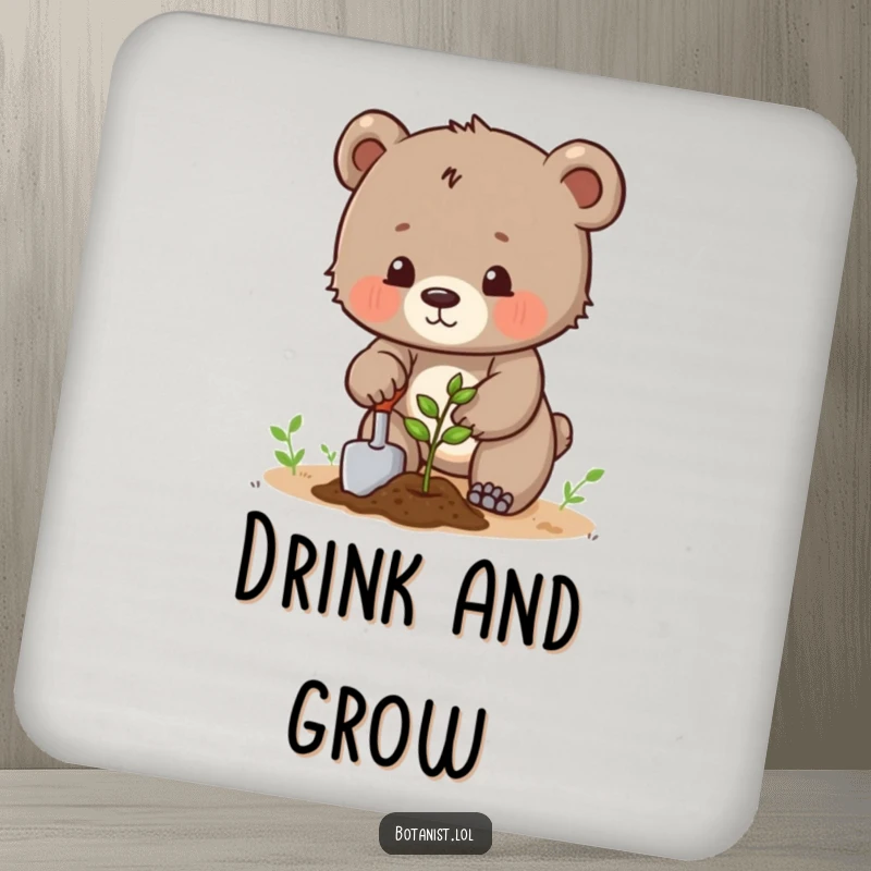 Funny determined bear cub planting a seed with a trowel, a humorous coaster for drink protection. Perfect gift.