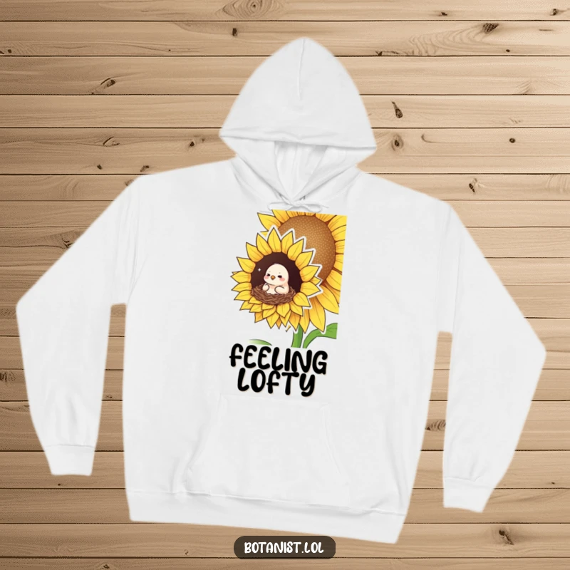 Funny hoodie depicting a small bird looking pleased and cozy, nestled in a giant sunflower, a warm and heartwarming design.
