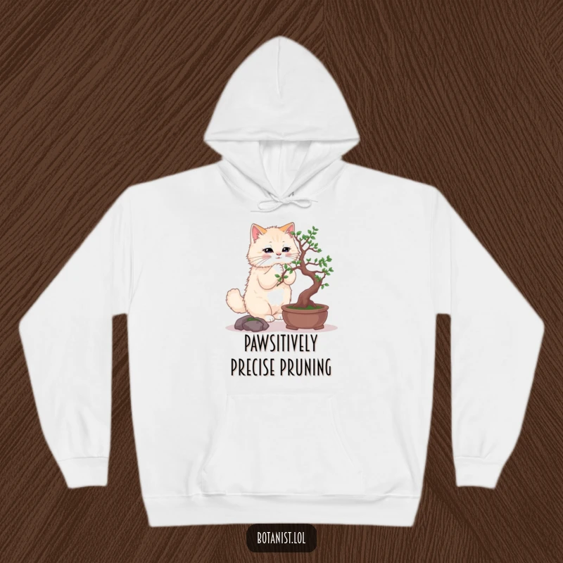 Funny hoodie with a fluffy cat precisely pruning a miniature bonsai tree, demonstrating intense focus.