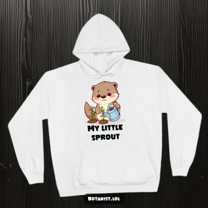 Funny hoodie design featuring a playful otter using a tiny watering can to nurture a small, smiling seedling, radiating warmth and humor.