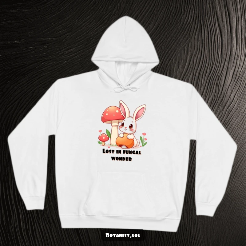Funny hoodie featuring a rabbit with wide eyes marveling at a large, colorful mushroom, a cozy funny gift.