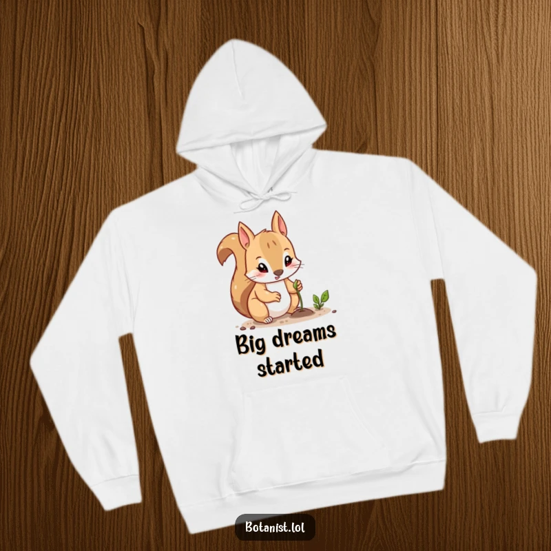 Funny hoodie with a curious squirrel looking determined while planting a tiny seed, representing diligent effort and future growth.