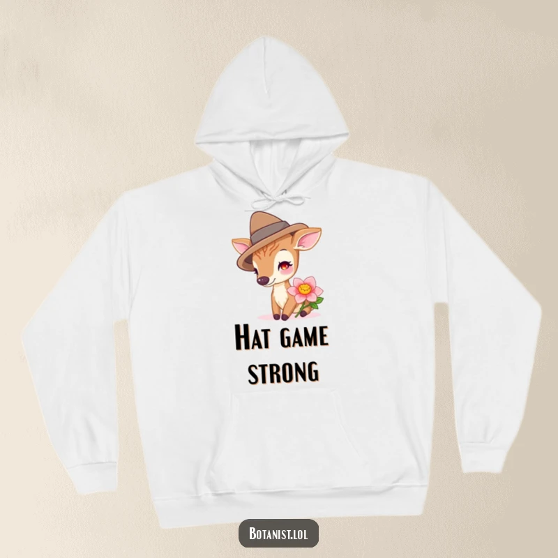 Funny deer sporting a hat while sniffing a vibrant bloom, featured on this cozy and whimsical hoodie.