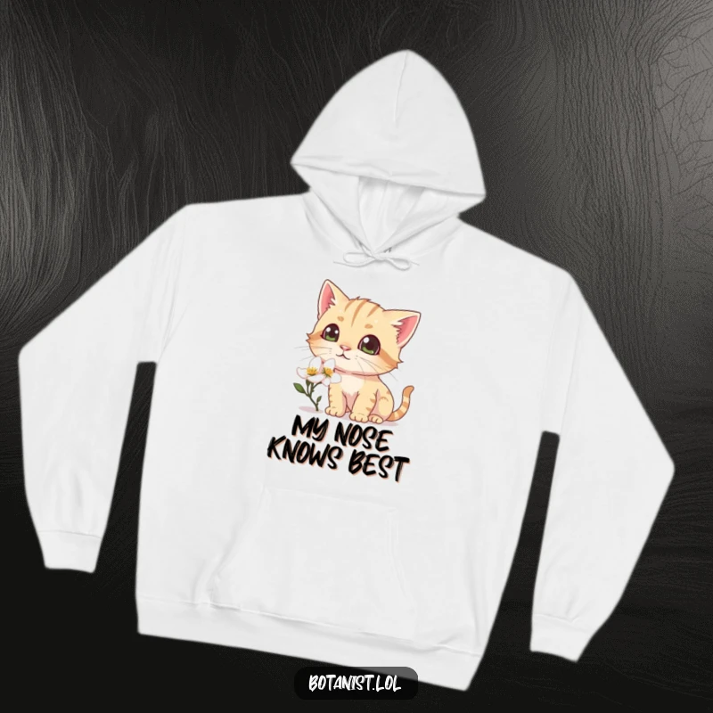 Funny hoodie illustration of a curious cat sniffing a dewy blossom, its eyes wide with delightful discovery.