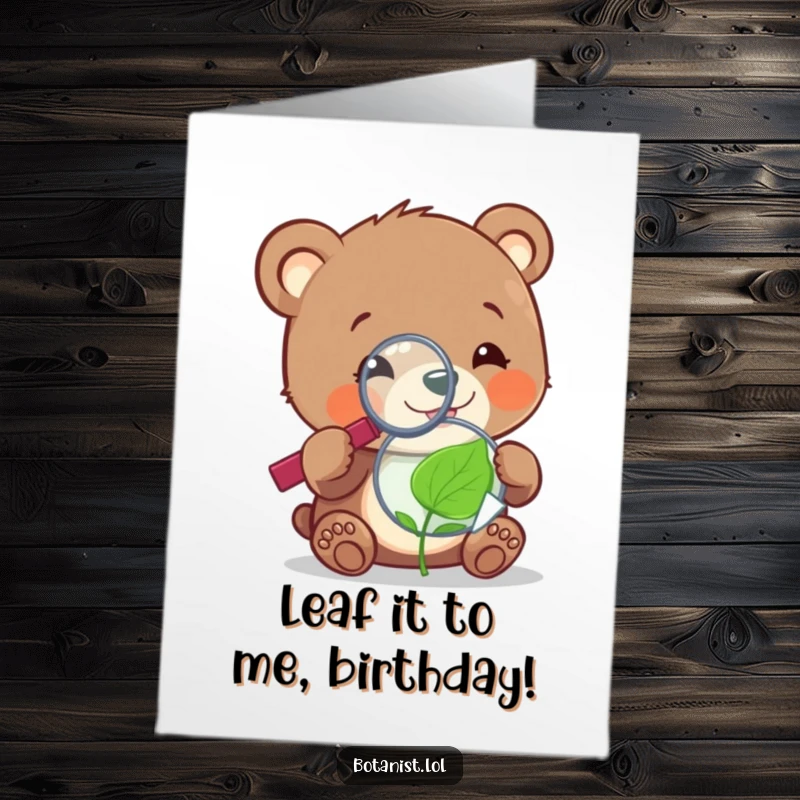 Funny Free Printable Birthday Card: A cheerful bear cub intently uses a magnifying glass to examine a tiny, sentient leaf.