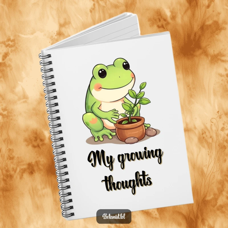 Funny notebook cover art of a playful frog carefully tending to a tiny potted sapling, ready for jotting notes.