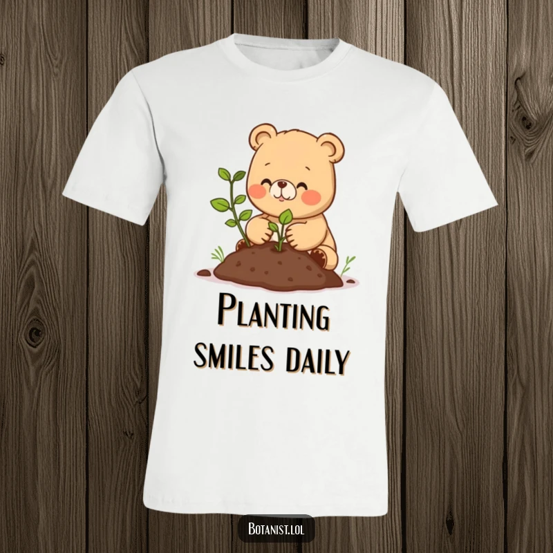 Funny T-shirt depicting a joyful bear cub meticulously planting a small seedling in fresh soil, radiating warmth and care.