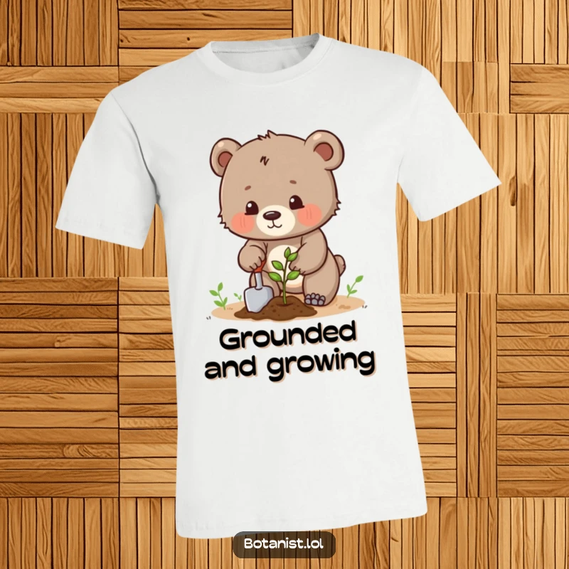 Funny determined bear cub using a trowel to plant a seed, a humorous and motivational t-shirt. Great gift.