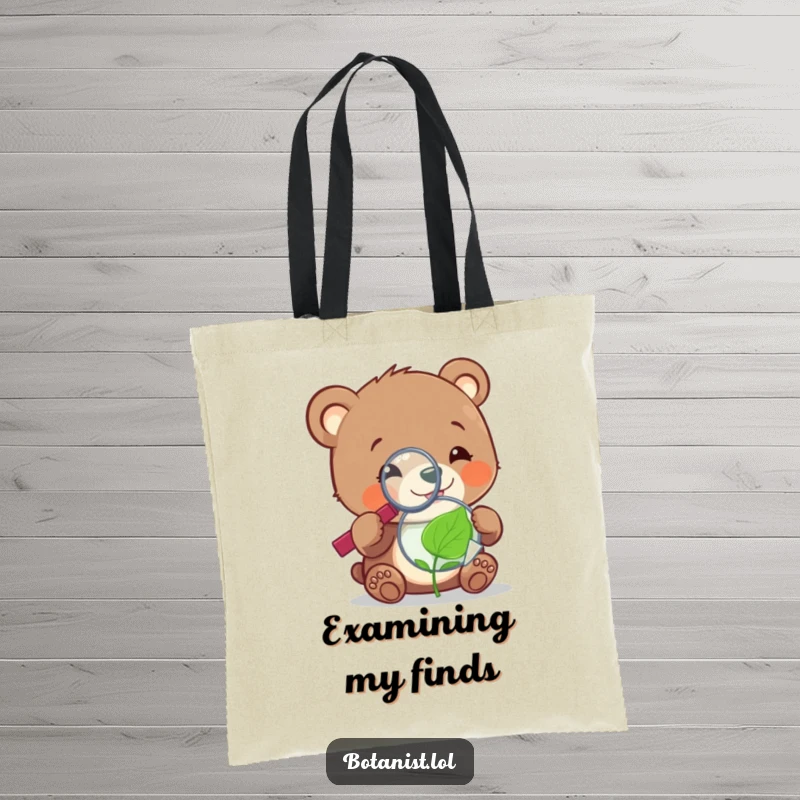 Funny cheerful bear cub with a magnifying glass, focused on a tiny, sentient leaf, displayed on a spacious tote bag.