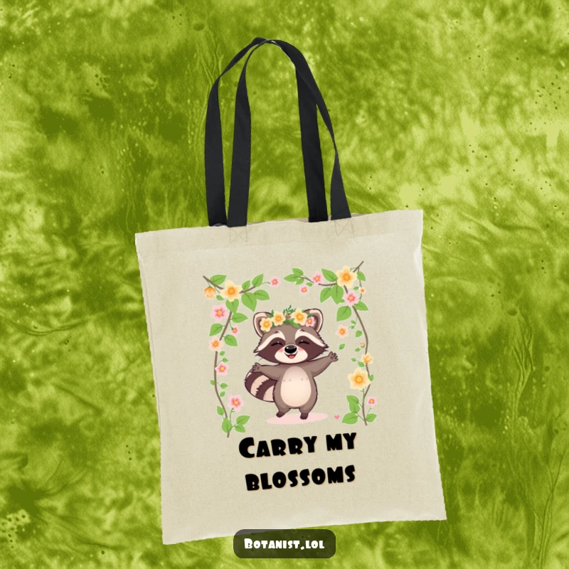 Funny raccoon tote bag featuring a giggling raccoon in a flower crown dancing among blooming vines, a whimsical and useful accessory.